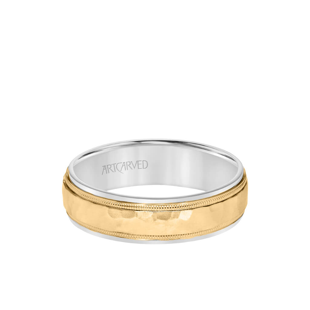 Close-up of hammered two-tone wedding ring with milgrain accents