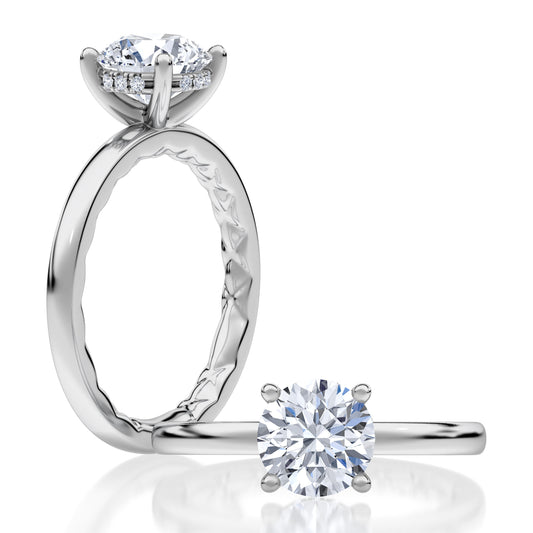 A timeless solitaire engagement ring showcasing an round-cut center diamond. Its clean, elegant lines make it an enduring choice for those who appreciate refined simplicity. MECRD2959Q/208