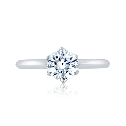From the Classics collection, this 6 prong solitaire engagement ring features a high shine shank and a touch of pave diamonds under the crown. ME1689/154