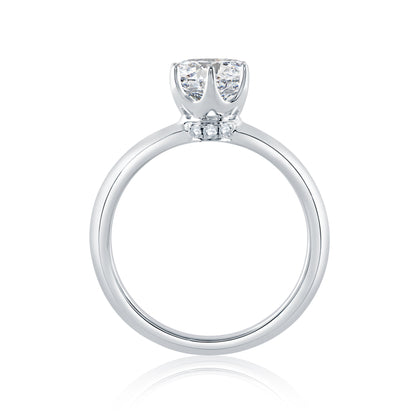 From the Classics collection, this 6 prong solitaire engagement ring features a high shine shank and a touch of pave diamonds under the crown. ME1689/204