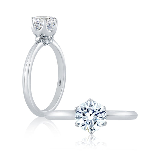 From the Classics collection, this 6 prong solitaire engagement ring features a high shine shank and a touch of pave diamonds under the crown. ME1689/79