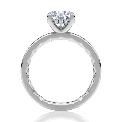 A timeless solitaire engagement ring showcasing an round-cut center diamond. Its clean, elegant lines make it an enduring choice for those who appreciate refined simplicity. MECRD2959Q/131